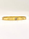 Elegant Cartier-inspired bangle bracelet with artificial diamonds, perfect for everyday wear or special occasions.