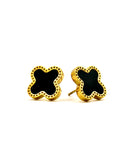 Stylish gold and black stud earrings, featuring a delicate clover design.