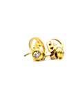 Stylish gold stud earrings with crystal details, neatly packaged in a black box.