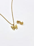 Elegant butterfly pendant and earrings set in gold, perfect for a sophisticated look.