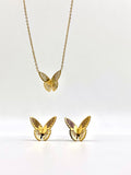 Elegant butterfly pendant and earrings set in gold, perfect for a sophisticated look.