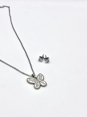 Elegant silver butterfly pendant necklace and crystal stud earrings set for women.